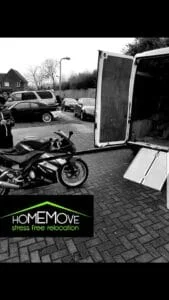 Motorbike being loaded into a HomeMove relocation van using a ramp