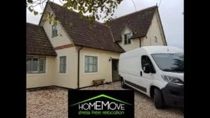 HomeMove relocation van parked outside a detached cream-colored house