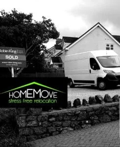 HomeMove relocation van parked outside a sold house with Robin King estate agent sign
