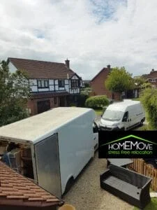 HomeMove van parked outside a sold house with estate agent sign visible